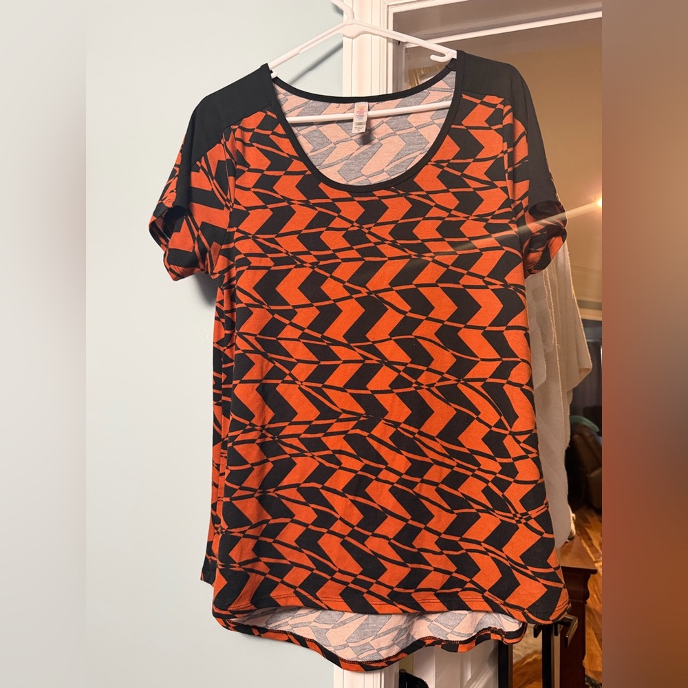 LuLaRoe Black and Orange Geometric Short Sleeve Top
